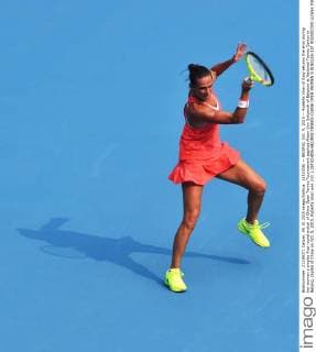 (151005) -- BEIJING, Oct. 5, 2015 -- Roberta Vinci of Italy returns the shot during her women s singles first round match of China Open Tennis Tournament against Alison Van Uytvanck of Belgium at National Tennis Center in Beijing, capital of China on Oct. 5, 2015. Roberta Vinci won 2-0. ) (SP)CHINA-BEIJING-TENNIS-CHINA OPEN-WOMEN S SINGLES-1ST ROUND(CN) LixWen 