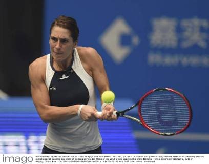 BEIJING, CHINA - OCTOBER 05: (CHINA OUT) Andrea Petkovic of Germany returns a shot against Eugenie Bouchard of Canada during day three of the 2015 China Open at the China National Tennis Centre on October 5, 2015 in Beijing, China.  CFP473922185 