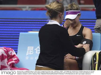 BEIJING, CHINA - OCTOBER 05: (CHINA OUT) Eugenie Bouchard of Canada receives treatment during the match against Andrea Petkovic of Germany during day three of the 2015 China Open at the China National Tennis Centre on October 5, 2015 in Beijing, China.  CFP473922188 