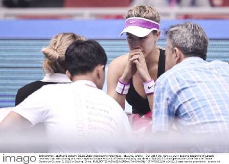 BEIJING, CHINA - OCTOBER 05: (CHINA OUT) Eugenie Bouchard of Canada receives treatment during the match against Andrea Petkovic of Germany during day three of the 2015 China Open at the China National Tennis Centre on October 5, 2015 in Beijing, China.  CFP473922194 