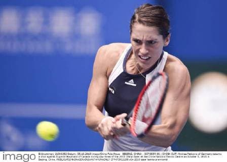 BEIJING, CHINA - OCTOBER 05: (CHINA OUT) Andrea Petkovic of Germany returns a shot against Eugenie Bouchard of Canada during day three of the 2015 China Open at the China National Tennis Centre on October 5, 2015 in Beijing, China.  CFP473922198 