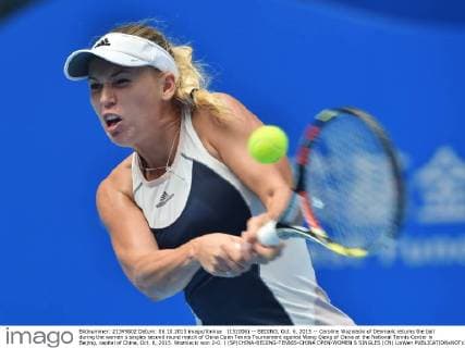 (151006) -- BEIJING, Oct. 6, 2015 -- Caroline Wozniacki of Denmark returns the ball during the women s singles second round match of China Open Tennis Tournament against Wang Qiang of China at the National Tennis Center in Beijing, capital of China, Oct. 6, 2015. Wozniacki won 2-0. ) (SP)CHINA-BEIJING-TENNIS-CHINA OPEN-WOMEN S SINGLES (CN) LixWen 
