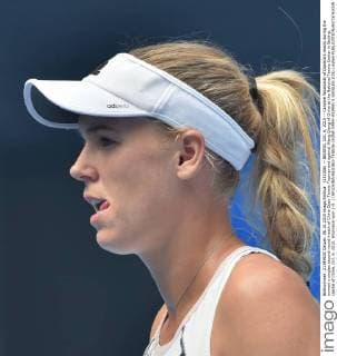 (151006) -- BEIJING, Oct. 6, 2015 -- Caroline Wozniacki of Danmark reacts during the women s singles second round match of China Open Tennis Tournament against Wang Qiang of China at the National Tennis Center in Beijing, capital of China, Oct. 6, 2015. Wozniacki won 2-0. ) (SP)CHINA-BEIJING-TENNIS-CHINA OPEN-WOMEN S SINGLES (CN) LixWen 