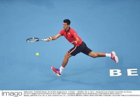 (151006) -- BEIJING, Oct. 6, 2015 -- Novak Djokovic of Serbia returns the ball during the men s singles first round match of China Open Tennis Tournament against Simone Bolelli of Italy at the National Tennis Center in Beijing, capital of China, Oct. 6, 2015. Djokovic won 2-0. ) (SP)CHINA-BEIJING-TENNIS-CHINA OPEN-MEN S SINGLES (CN) LixWen 