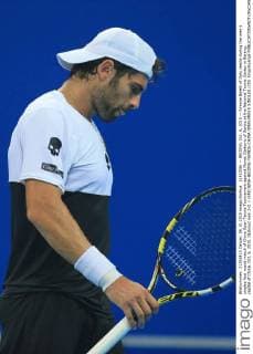 (151006) -- BEIJING, Oct. 6, 2015 -- Simone Bolelli of Italy reacts during the men s singles first round match of China Open Tennis Tournament against Novak Djokovic of Serbia at the National Tennis Center in Beijing, capital of China, Oct. 6, 2015. Djokovic won 2-0. ) (SP)CHINA-BEIJING-TENNIS-CHINA OPEN-MEN S SINGLES (CN) XingxGuangli 