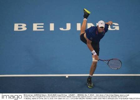 (151007) -- BEIJING, Oct. 7, 2015 -- John Isner of the United States returns a ball during the men s singles first round match of China Open Tennis Tournament against Dominic Thiem of Austria at the National Tennis Center in Beijing, capital of China, Oct. 6, 2015. John Isner won 2-0. ) (SP)CHINA-BEIJING-TENNIS-CHINA OPEN-MEN S SINGLES (CN) XingxGuangli 