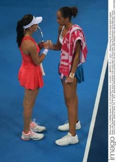 (151007) -- BEIJING, Oct. 7, 2015 -- Madison Keys (R) of the United States shakes hands with Agnieszka Radwanska of Poland after the women s singles third round match of China Open Tennis Tournament at the National Tennis Center in Beijing, capital of China, Oct. 7, 2015. Agnieszka Radwanska was qualified for the next round after Madison Keys retired from the match.) (SP)CHINA-BEIJING-TENNIS-CHINA OPEN-WOMEN S SINGLES (CN) XingxGuangli 