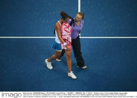 (151007) -- BEIJING, Oct. 7, 2015 -- Madison Keys of the United States leaves after retiring from the women s singles third round match of China Open Tennis Tournament against Agnieszka Radwanska of Poland at the National Tennis Center in Beijing, capital of China, Oct. 7, 2015. Agnieszka Radwanska was qualified for the next round after Madison Keys retired from the match.) (SP)CHINA-BEIJING-TENNIS-CHINA OPEN-WOMEN S SINGLES (CN) XingxGuangli 