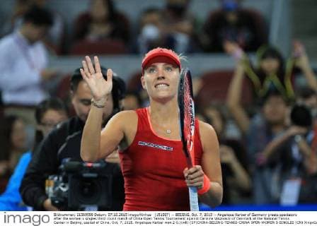 (151007) -- BEIJING, Oct. 7, 2015 -- Angelique Kerber of Germany greets spectators after the women s singles third round match of China Open Tennis Tournament against Caroline Wozniacki of Denmark at the National Tennis Center in Beijing, capital of China, Oct. 7, 2015. Angelique Kerber won 2-0.)(wll) (SP)CHINA-BEIJING-TENNIS-CHINA OPEN-WOMEN S SINGLES (CN) XingxGuangli 