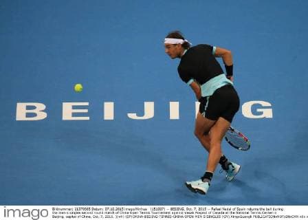 (151007) -- BEIJING, Oct. 7, 2015 -- Rafael Nadal of Spain returns the ball during the men s singles second round match of China Open Tennis Tournament against Vasek Pospisil of Canada at the National Tennis Center in Beijing, capital of China, Oct. 7, 2015. )(wll) (SP)CHINA-BEIJING-TENNIS-CHINA OPEN-MEN S SINGLES (CN) XingxGuangli 