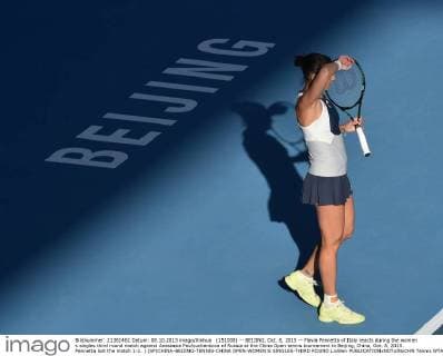 (151008) -- BEIJING, Oct. 8, 2015 -- Flavia Pennetta of Italy reacts during the women s singles third round match against Anastasia Pavlyuchenkova of Russia at the China Open tennis tournament in Beijing, China, Oct. 8, 2015. Pennetta lost the match 1-2. ) (SP)CHINA-BEIJING-TENNIS-CHINA OPEN-WOMEN S SINGLES-THIRD ROUND LixWen 