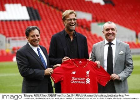 09.10.2015. Anfield, Liverpool, England. Jurgen Klopp Unveiling. Jurgen Klopp poses on the Anfield pitch with Tom Werner, Liverpool FC chairman and Ian Ayre, Liverpool FC chief executive officer after today s press conference PK Pressekonferenz at Anfield. Klopp, former manager of Borussia Dortmund, has been appointed on a three year contract. xAlanxMartinx  ActionPlus11670344