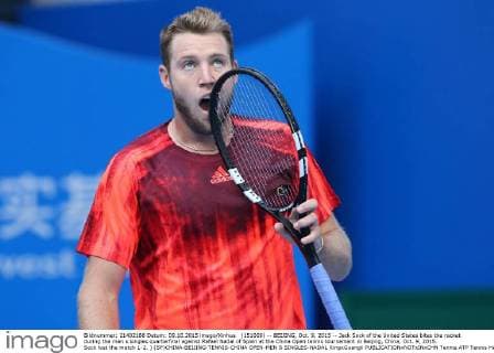 (151009) -- BEIJING, Oct. 9, 2015 -- Jack Sock of the United States bites the racket during the men s singles quarterfinal against Rafael Nadal of Spain at the China Open tennis tournament in Beijing, China, Oct. 9, 2015. Sock lost the match 1-2. ) (SP)CHINA-BEIJING-TENNIS-CHINA OPEN-MEN S SINGLES-NADAL XingxGuangli 