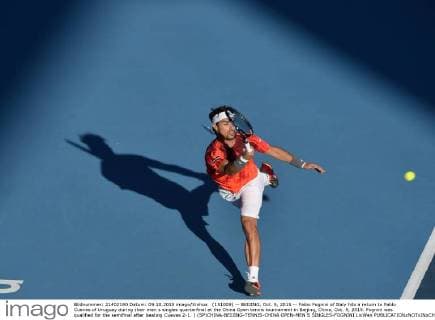(151009) -- BEIJING, Oct. 9, 2015 -- Fabio Fognini of Italy hits a return to Pablo Cuevas of Uruguay during their men s singles quarterfinal at the China Open tennis tournament in Beijing, China, Oct. 9, 2015. Fognini was qualified for the semifinal after beating Cuevas 2-1. ) (SP)CHINA-BEIJING-TENNIS-CHINA OPEN-MEN S SINGLES-FOGNINI LixWen 