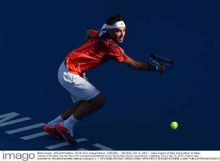 (151009) -- BEIJING, Oct. 9, 2015 -- Fabio Fognini of Italy hits a return to Pablo Cuevas of Uruguay during their men s singles quarterfinal at the China Open tennis tournament in Beijing, China, Oct. 9, 2015. Fognini was qualified for the semifinal after beating Cuevas 2-1. ) (SP)CHINA-BEIJING-TENNIS-CHINA OPEN-MEN S SINGLES-FOGNINI LixWen 
