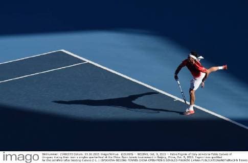 (151009) -- BEIJING, Oct. 9, 2015 -- Fabio Fognini of Italy serves to Pablo Cuevas of Uruguay during their men s singles quarterfinal at the China Open tennis tournament in Beijing, China, Oct. 9, 2015. Fognini was qualified for the semifinal after beating Cuevas 2-1. ) (SP)CHINA-BEIJING-TENNIS-CHINA OPEN-MEN S SINGLES-FOGNINI LixWen 