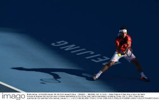 (151009) -- BEIJING, Oct. 9, 2015 -- Fabio Fognini of Italy hits a return to Pablo Cuevas of Uruguay during their men s singles quarterfinal at the China Open tennis tournament in Beijing, China, Oct. 9, 2015. Fognini was qualified for the semifinal after beating Cuevas 2-1. ) (SP)CHINA-BEIJING-TENNIS-CHINA OPEN-MEN S SINGLES-FOGNINI LixWen 