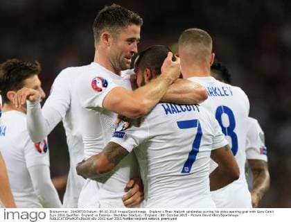 England s Theo Walcott celebrates scoring his sides opening goal with Gary Cahill Euro 2016 Qualifier- England vs Estonia - Wembley Stadium - England - 9th October 2015 - Picture David Klein Sportimage EDITORIAL USE ONLY. No use with unauthorised audio, video, data, fixture lists, club league logos or live services. Online in-match use limited to 120 images, no video emulation. No use in betting, games or single club league player publications.