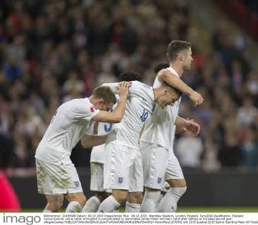 09.10.2015. Wembley Stadium, London, England. Euro2016 Qualification. England versus Estonia. Jamie Vardy of England is congratulated by teammates James Milner and Gary Cahill after setting up his sides second goal. xNigelxCookex  ActionPlus11670502