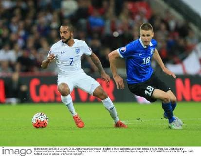 England s Theo Walcott tussles with Estonia s Karol Mets Euro 2016 Qualifier- England vs Estonia - Wembley Stadium - England - 9th October 2015 - Picture David Klein Sportimage EDITORIAL USE ONLY. No use with unauthorised audio, video, data, fixture lists, club league logos or live services. Online in-match use limited to 120 images, no video emulation. No use in betting, games or single club league player publications.