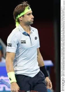 (151010) -- BEIJING, Oct. 10, 2015 -- David Ferrer of Spain reacts during the men s singles semifinal against Novak Djokovic of Serbia at 2015 China Open Tennis Tournament in Beijing, China, Oct. 10, 2015. Ferrer lost the match 0-2. ) (SP)CHINA-BEIJING-TENNIS-CHINA OPEN-MEN S SINGLES XingxGuangli 