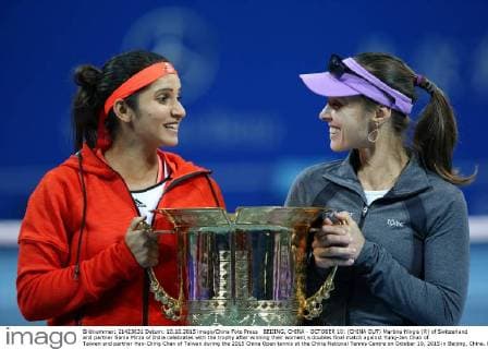 BEIJING, CHINA - OCTOBER 10: (CHINA OUT) Martina Hingis (R) of Switzerland and partner Sania Mirza of India celebrates with the trophy after winning their women s doubles final match against Yung-Jan Chan of Taiwan and partner Hao-Ching Chan of Taiwan during the 2015 China Open tennis at the China National Tennis Centre on October 10, 2015 in Beijing, China.  CFP474184496 