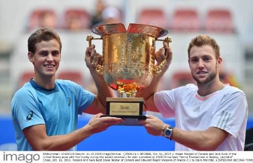 (151011) -- BEIJING, Oct. 11, 2015 -- Vasek Pospisil of Canada and Jack Sock of the United States pose with the trophy during the award ceremony for men s doubles at 2015 China Open Tennis Tournament in Beijing, capital of China, Oct. 11, 2015. Pospisil and Sock beat Danel Nestor of Canada and Edouard Roger-Vasselin of France 2-1 to claim the title. ) (SP)CHINA-BEIJING-TENNIS-CHINA OPEN-MEN S DOUBLES LixWen 