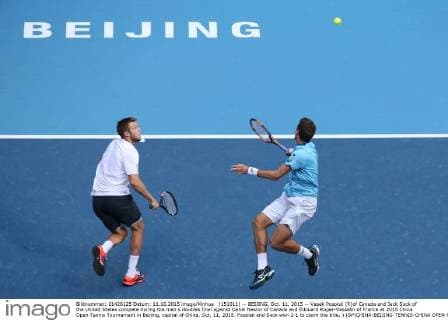 (151011) -- BEIJING, Oct. 11, 2015 -- Vasek Pospisil (R)of Canada and Jack Sock of the United States compete during the men s doubles final against Danel Nestor of Canada and Edouard Roger-Vasselin of France at 2015 China Open Tennis Tournament in Beijing, capital of China, Oct. 11, 2015. Pospisil and Sock won 2-1 to claim the title. ) (SP)CHINA-BEIJING-TENNIS-CHINA OPEN-MEN S DOUBLES XingxGuangli 