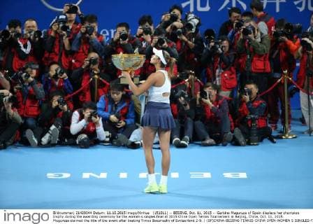 (151011) -- BEIJING, Oct. 11, 2015 -- Garbine Muguruza of Spain displays her champion trophy during the awarding ceremony for the women s singles final at 2015 China Open Tennis Tournament in Beijing, China, Oct. 11, 2015. Muguruza claimed the title of the event after beating Timea Bacsinszky of Switzerland 2-0. ) (SP)CHINA-BEIJING-TENNIS-CHINA OPEN-WOMEN S SINGLES-FINAL XingxGuangli 