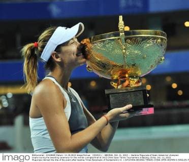 (151011) -- BEIJING, Oct. 11, 2015 -- Garbine Muguruza of Spain kisses her champion trophy during the awarding ceremony for the women s singles final at 2015 China Open Tennis Tournament in Beijing, China, Oct. 11, 2015. Muguruza claimed the title of the event after beating Timea Bacsinszky of Switzerland 2-0. ) (SP)CHINA-BEIJING-TENNIS-CHINA OPEN-WOMEN S SINGLES-FINAL LixWen 