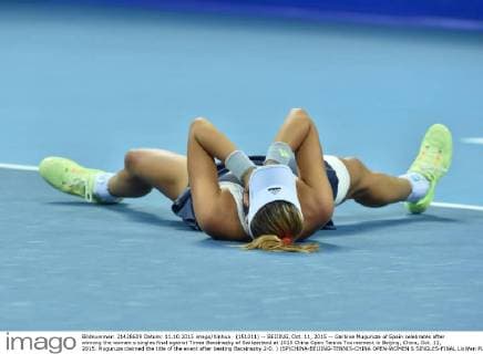 (151011) -- BEIJING, Oct. 11, 2015 -- Garbine Muguruza of Spain celebrates after winning the women s singles final against Timea Bacsinszky of Switzerland at 2015 China Open Tennis Tournament in Beijing, China, Oct. 11, 2015. Muguruza claimed the title of the event after beating Bacsinszky 2-0. ) (SP)CHINA-BEIJING-TENNIS-CHINA OPEN-WOMEN S SINGLES-FINAL LixWen 