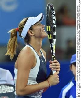 (151011) -- BEIJING, Oct. 11, 2015 -- Garbine Muguruza of Spain reacts after winning the women s singles final against Timea Bacsinszky of Switzerland at 2015 China Open Tennis Tournament in Beijing, China, Oct. 11, 2015. Muguruza claimed the title of the event after beating Bacsinszky 2-0. ) (SP)CHINA-BEIJING-TENNIS-CHINA OPEN-WOMEN S SINGLES-FINAL LixWen 