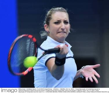 (151011) -- BEIJING, Oct. 11, 2015 -- Timea Bacsinszky of Switzerland serves to Garbine Muguruza of Spain during the women s singles final at 2015 China Open Tennis Tournament in Beijing, China, Oct. 11, 2015. Timea Bacsinszky of Switzerland lost the match 0-2. ) (SP)CHINA-BEIJING-TENNIS-CHINA OPEN-WOMEN S SINGLES-FINAL LixWen 