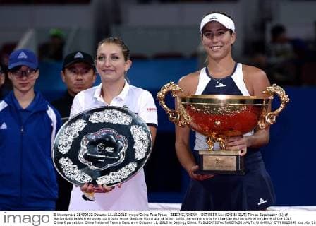 BEIJING, CHINA - OCTOBER 11: (CHINA OUT) Timea Bacsinszky (L) of Switzerland holds the runner up trophy while Garbine Muguruza of Spain holds the winners trophy after the Womens Final on day 9 of the 2015 China Open at the China National Tennis Centre on October 11, 2015 in Beijing, China.  CFP66018638 