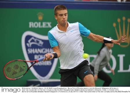 Borna Coric of Coratia returns a shot to Alexandr Dolgopolov of Ukraine in their first round match of the men s singles during the 2015 Shanghai Rolex Masters tennis tournament in Shanghai, China, 11 October 2015. Borna Coric of Coratia defeated Alexandr Dolgopolov of Ukraine 2-1 (6-3 1-6 7-6) in their first round match of the men s singles during the 2015 Shanghai Rolex Masters tennis tournament in Shanghai, China, 11 October 2015. Borna Coric kicks out Alexandr Dolgopolov at Shanghai Rolex Masters  pbu343494_02