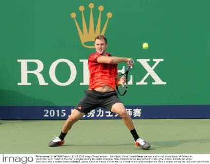 John Sock of the United States returns a shot to Lukasz Kubot of Poland in their first round match of the men s singles during the 2015 Shanghai Rolex Masters tennis tournament in Shanghai, China, 13 October 2015. John Sock of the United States defeated Lukasz Kubot of Poland 2-0 (6-4 6-2) in their first round match of the men s singles during the 2015 Shanghai Rolex Masters tennis tournament in Shanghai, China, 13 October 2015. John Sock eliminates Lukasz Kubot at Shanghai Rolex Masters  pbu344460_39