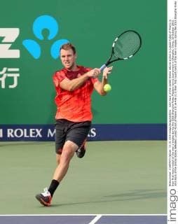 John Sock of the United States returns a shot to Lukasz Kubot of Poland in their first round match of the men s singles during the 2015 Shanghai Rolex Masters tennis tournament in Shanghai, China, 13 October 2015. John Sock of the United States defeated Lukasz Kubot of Poland 2-0 (6-4 6-2) in their first round match of the men s singles during the 2015 Shanghai Rolex Masters tennis tournament in Shanghai, China, 13 October 2015. John Sock eliminates Lukasz Kubot at Shanghai Rolex Masters  pbu344460_40