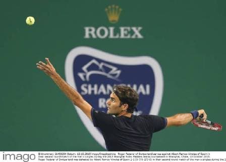 Roger Federer of Switzerland serves against Albert Ramos-Vinolas of Spain in their second round match of the men s singles during the 2015 Shanghai Rolex Masters tennis tournament in Shanghai, China, 13 October 2015. Roger Federer of Switzerland was defeated by Albert Ramos-Vinolas of Spain 1-2 (6-7 6-2 3-6) in their second round match of the men s singles during the 2015 Shanghai Rolex Masters tennis tournament in Shanghai, China, 13 October 2015. Roger Federer kicked out by Albert Ramos-Vinolas at Shanghai Rolex Masters  20151013_51032