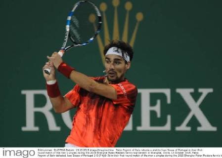 Fabio Fognini of Italy returns a shot to Joao Sousa of Portugal in their first round match of the men s singles during the 2015 Shanghai Rolex Masters tennis tournament in Shanghai, China, 13 October 2015. Fabio Fognini of Italy defeated Joao Sousa of Portugal 2-0 (7-6 6-3) in their first round match of the men s singles during the 2015 Shanghai Rolex Masters tennis tournament in Shanghai, China, 13 October 2015. Fabio Fognini defeats Joao Sousa at Shanghai Rolex Masters  pbu344604_06