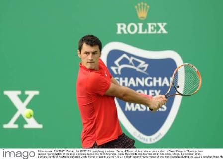 Bernard Tomic of Australia returns a shot to David Ferrer of Spain in their second round match of the men s singles during the 2015 Shanghai Rolex Masters tennis tournament in Shanghai, China, 14 October 2015. Bernard Tomic of Australia defeated David Ferrer of Spain 2-0 (6-4 6-2) in their second round match of the men s singles during the 2015 Shanghai Rolex Masters tennis tournament in Shanghai, China, 14 October 2015. David Ferrer kicked out by Bernard Tomic at Shanghai Rolex Masters  pbu344940_07