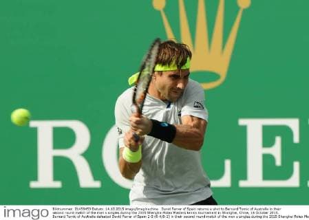 David Ferrer of Spain returns a shot to Bernard Tomic of Australia in their second round match of the men s singles during the 2015 Shanghai Rolex Masters tennis tournament in Shanghai, China, 14 October 2015. Bernard Tomic of Australia defeated David Ferrer of Spain 2-0 (6-4 6-2) in their second round match of the men s singles during the 2015 Shanghai Rolex Masters tennis tournament in Shanghai, China, 14 October 2015. David Ferrer kicked out by Bernard Tomic at Shanghai Rolex Masters  pbu344940_12