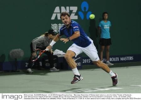 Stanislas Wawrinka of Switzerland returns a shot to Viktor Troicki of Serbia in their second round match of the men s singles during the 2015 Shanghai Rolex Masters tennis tournament in Shanghai, China, 14 October 2015. Stanislas Wawrinka of Switzerland defeated Viktor Troicki of Serbia 2-0 (7-6 6-3) in their second round match of the men s singles during the 2015 Shanghai Rolex Masters tennis tournament in Shanghai, China, 14 October 2015. Stanislas Wawrinka knocks out Viktor Troicki at Shanghai Rolex Masters  pbu345165_19