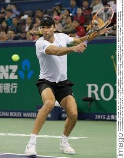 Ivo Karlovic of Croatia returns a shot to Rafael Nadal of Spain in their second round match of the men s singles during the 2015 Shanghai Rolex Masters tennis tournament in Shanghai, China, 14 October 2015. Rafael Nadal of Spain defeated Ivo Karlovic of Croatia 2-1 (7-5 6-7 7-6) in their second round match of the men s singles during the 2015 Shanghai Rolex Masters tennis tournament in Shanghai, China, 14 October 2015. Rafael Nadal defeats Ivo Karlovic at Shanghai Rolex Masters  20151014_37053