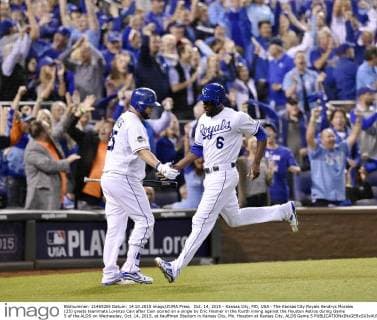 Oct. 14, 2015 - Kansas City, MO, USA - The Kansas City Royals Kendrys Morales (25) greets teammate Lorenzo Cain after Cain scored on a single by Eric Hosmer in the fourth inning against the Houston Astros during Game 5 of the ALDS on Wednesday, Oct. 14, 2015, at Kauffman Stadium in Kansas City, Mo. Houston at Kansas City, ALDS Game 5 - ZUMAm67_