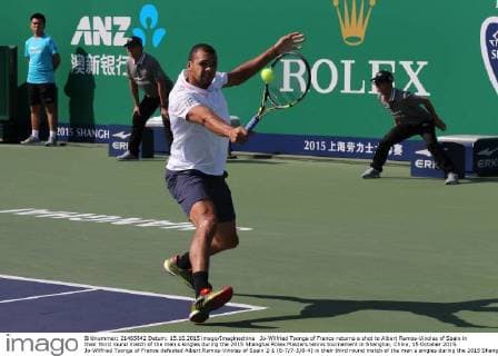 Jo-Wilfried Tsonga of France returns a shot to Albert Ramos-Vinolas of Spain in their third round match of the men s singles during the 2015 Shanghai Rolex Masters tennis tournament in Shanghai, China, 15 October 2015. Jo-Wilfried Tsonga of France defeated Albert Ramos-Vinolas of Spain 2-1 (6-7 7-5 6-4) in their third round match of the men s singles during the 2015 Shanghai Rolex Masters tennis tournament in Shanghai, China, 15 October 2015. Jo-Wilfried Tsonga defeats Albert Ramos-Vinolas at Shanghai Rolex Masters  20151015_09818