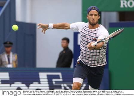 Feliciano Lopez of Spain returns a shot to Novak Djokovic of Serbia in their third round match of the men s singles during the 2015 Shanghai Rolex Masters tennis tournament in Shanghai, China, 15 October 2015. Novak Djokovic of Serbia defeated Feliciano Lopez of Spain 2-0 (6-2 6-3) in their third round match of the men s singles during the 2015 Shanghai Rolex Masters tennis tournament in Shanghai, China, 15 October 2015. Novak Djokovic conquers Feliciano Lopez at Shanghai Rolex Masters  20151015_33938
