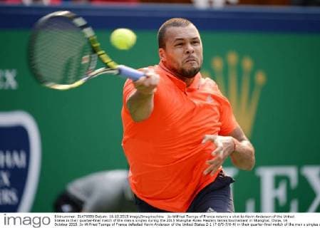 Jo-Wilfried Tsonga of France returns a shot to Kevin Anderson of the United States in their quarter-final match of the men s singles during the 2015 Shanghai Rolex Masters tennis tournament in Shanghai, China, 16 October 2015. Jo-Wilfried Tsonga of France defeated Kevin Anderson of the United States 2-1 (7-6 5-7 6-4) in their quarter-final match of the men s singles during the 2015 Shanghai Rolex Masters tennis tournament in Shanghai, China, 16 October 2015. Jo-Wilfried Tsonga eliminates Kevin Anderson at Shanghai Rolex Masters  20151016_49326