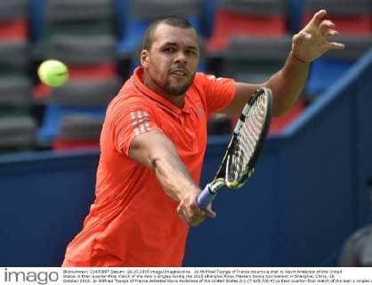 Jo-Wilfried Tsonga of France returns a shot to Kevin Anderson of the United States in their quarter-final match of the men s singles during the 2015 Shanghai Rolex Masters tennis tournament in Shanghai, China, 16 October 2015. Jo-Wilfried Tsonga of France defeated Kevin Anderson of the United States 2-1 (7-6 5-7 6-4) in their quarter-final match of the men s singles during the 2015 Shanghai Rolex Masters tennis tournament in Shanghai, China, 16 October 2015. Jo-Wilfried Tsonga eliminates Kevin Anderson at Shanghai Rolex Masters  20151016_63694
