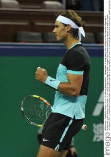 Rafael Nadal of Spain reacts after scoring against Stanislas Wawrinka of Switzerland in their quarter-final match of the men s singles during the 2015 Shanghai Rolex Masters tennis tournament in Shanghai, China, 16 October 2015. Rafael Nadal of Spain defeated Stanislas Wawrinka of Switzerland 2-0 (6-2 6-1) in their quarter-final match of the men s singles during the 2015 Shanghai Rolex Masters tennis tournament in Shanghai, China, 16 October 2015. Rafael Nadal ousts Stanislas Wawrinka to advance to semi-final at Shanghai Rolex Masters  pbu346235_14