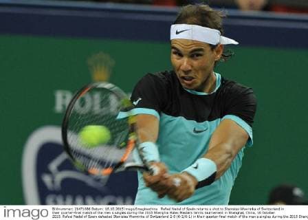 Rafael Nadal of Spain returns a shot to Stanislas Wawrinka of Switzerland in their quarter-final match of the men s singles during the 2015 Shanghai Rolex Masters tennis tournament in Shanghai, China, 16 October 2015. Rafael Nadal of Spain defeated Stanislas Wawrinka of Switzerland 2-0 (6-2 6-1) in their quarter-final match of the men s singles during the 2015 Shanghai Rolex Masters tennis tournament in Shanghai, China, 16 October 2015. Rafael Nadal ousts Stanislas Wawrinka to advance to semi-final at Shanghai Rolex Masters  pbu346245_20